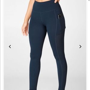 Fabletics navy blue leggings with pocket.